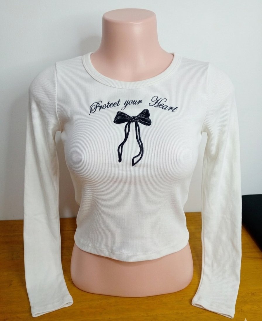 Blusa manga larga diseño con moño